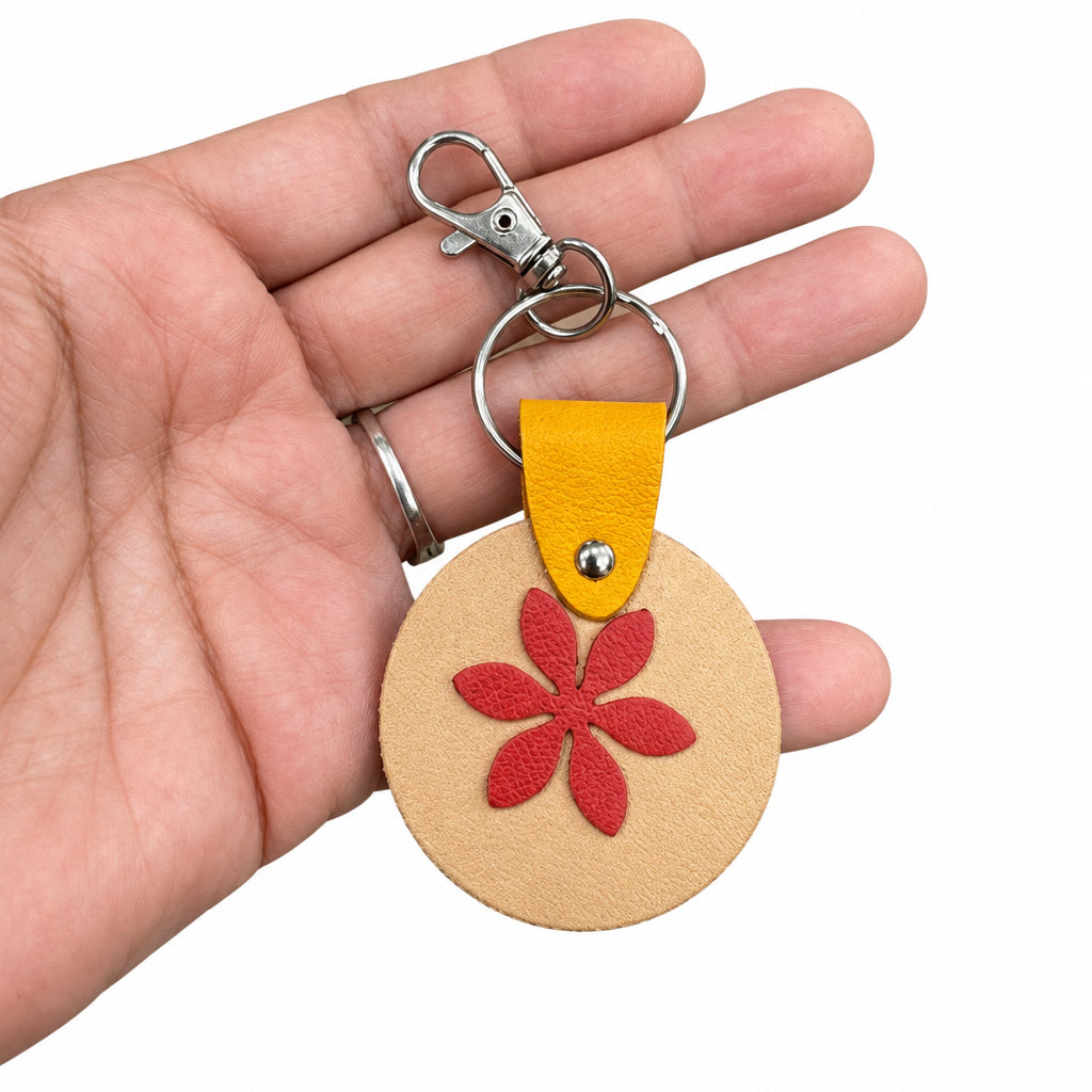 Porte-clés / bijou de sac rond en cuir orange