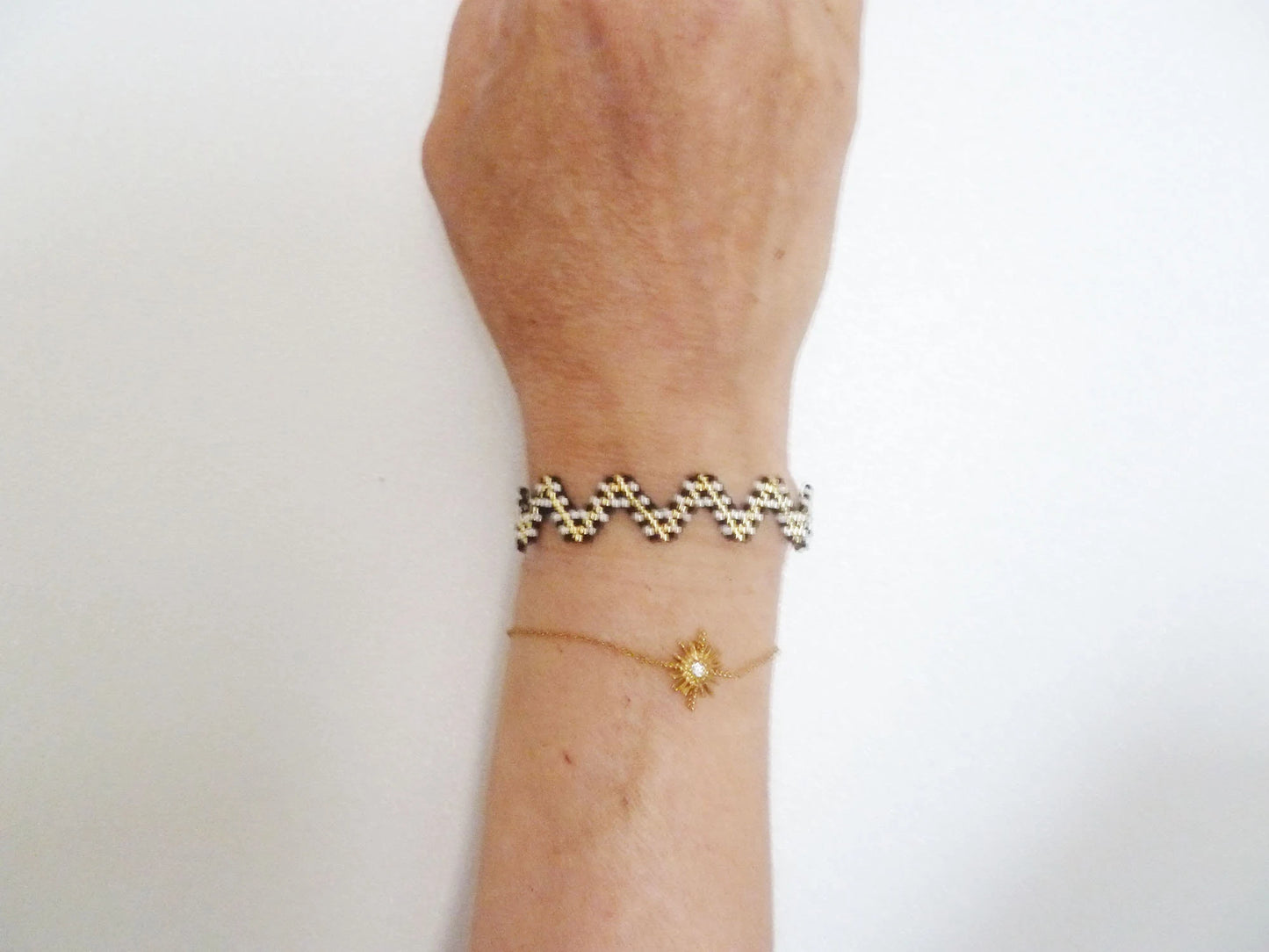 Woven bracelet zigzag shape black ecru gold bohemian graphic inspiration