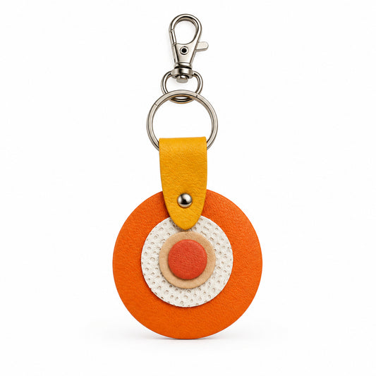Porte-clés / bijou de sac rond en cuir orange