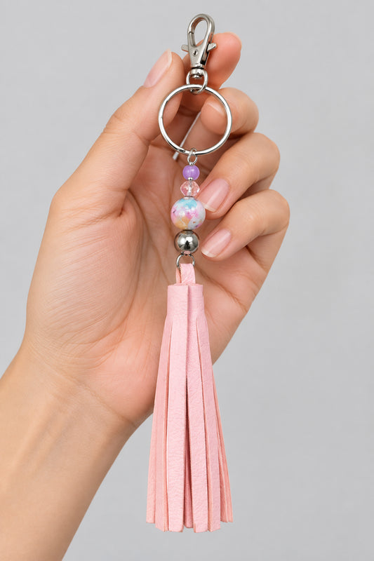 Porte-clés / bijou de sac pompon en cuir rose pâle