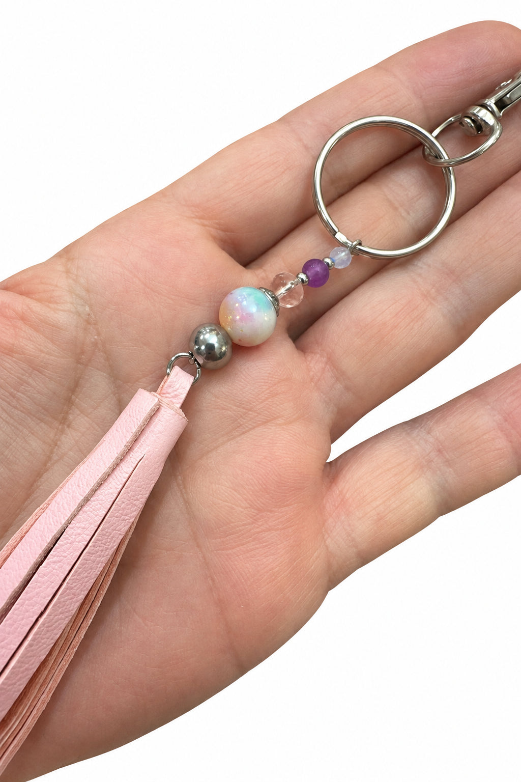 Porte-clés / bijou de sac pompon en cuir rose pâle