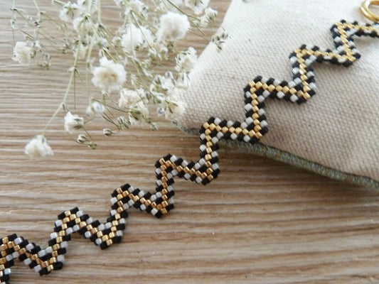Woven bracelet zigzag shape black ecru gold bohemian graphic inspiration