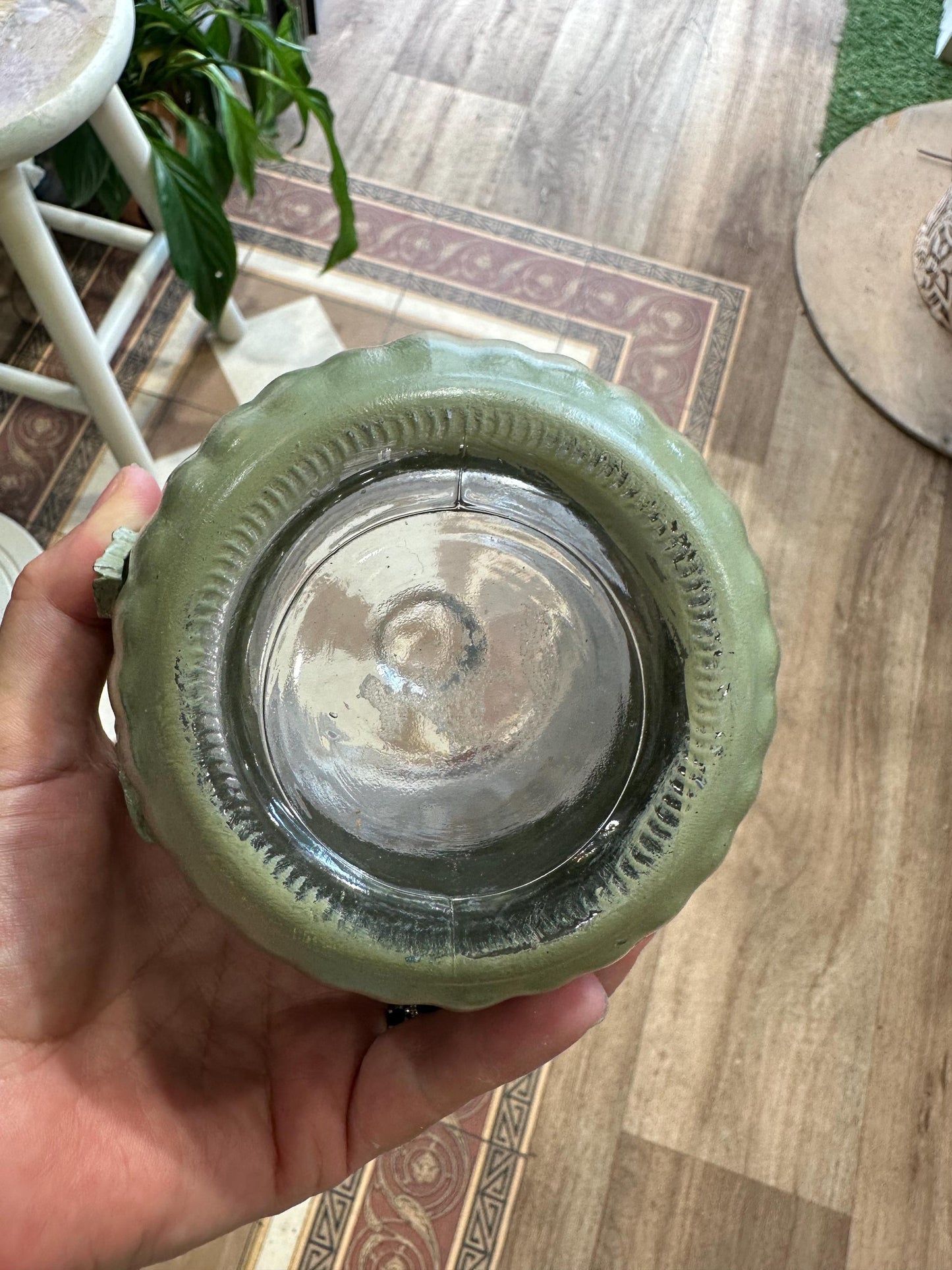 Khaki painted glass jar decorated with foliage