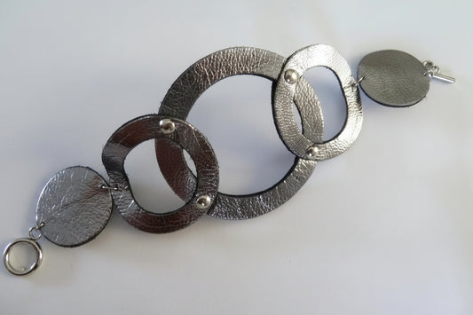 Large dark silver leather cuff, intertwined circles, original chic style