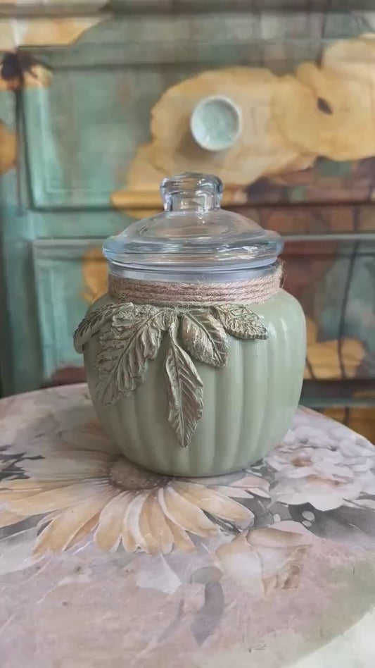 Khaki painted glass jar decorated with foliage